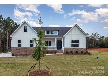 Charming farmhouse style home with brick and white siding at 1336 Sage Pine Cir # 21, Clover, SC 29710