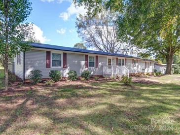 Ranch home with gray siding and maroon shutters at 2660 Odell School Rd, Concord, NC 28027