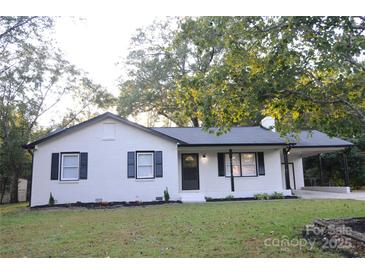 Newly renovated ranch home with carport and landscaped yard at 4901 Greenwood Dr, Gastonia, NC 28052