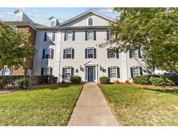 Townhouse exterior with a manicured lawn at 3897 Carl Parmer Dr, Harrisburg, NC 28075