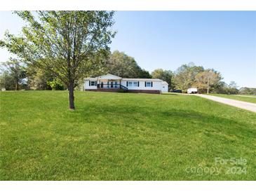 Single-story home with a large front yard at 1375 Woodend Ln, Clover, SC 29710