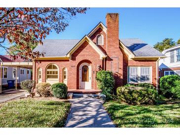 Brick house with landscaping and walkway at 223 N Oak St, Statesville, NC 28677