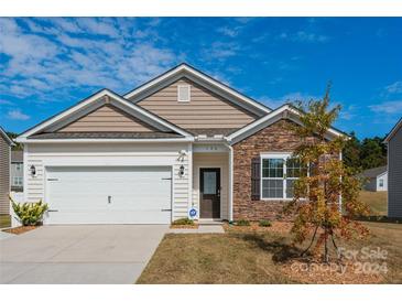 Newly built craftsman style home with stone and siding at 126 Flame Azalea Ct, Locust, NC 28097