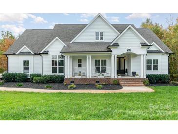 White farmhouse exterior with a front porch and landscaped lawn at 1851 White Fawn Ln, Rock Hill, SC 29730