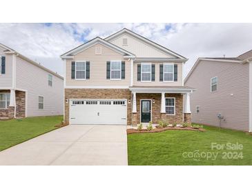 Two-story home with stone and neutral siding at 3863 Maxwell Henry Nw Ln, Conover, NC 28613