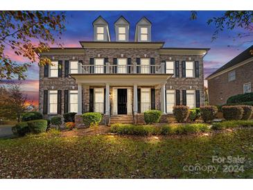 Stunning two-story brick home with landscaped yard at 9440 Wallace Pond Dr, Huntersville, NC 28078