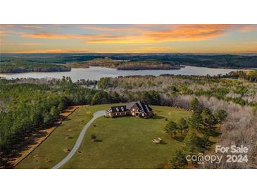 Luxury home with lake view; long driveway and expansive property at 590 Tuckertown Rd, New London, NC 28127