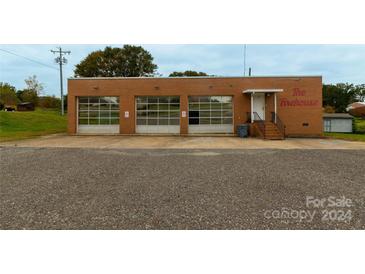 Brick firehouse building with three large garage doors and signage at 907 Bethlehem Rd, Kings Mountain, NC 28086