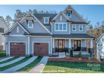 Two-story home with gray siding and a two-car garage at 18148 Kalabash Rd, Charlotte, NC 28278