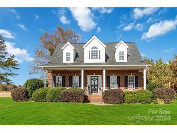 Brick house with front porch and landscaping at 4815 Sugar And Wine Rd, Monroe, NC 28110