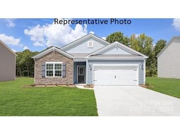 One-story home with stone and gray siding, and a two-car garage at 8039 Plymouth Dr, Sherrills Ford, NC 28673