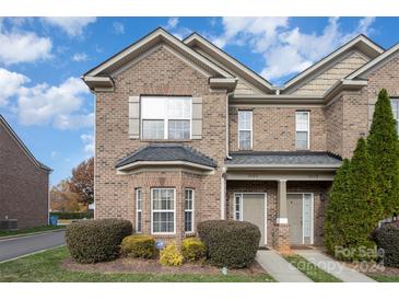 Brick front exterior of charming townhome with landscaping at 5682 Stafford Rd, Charlotte, NC 28215