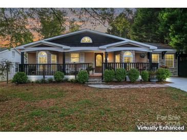 Charming house exterior with front porch and landscaping at 138 Wyanoke Ave, Charlotte, NC 28205