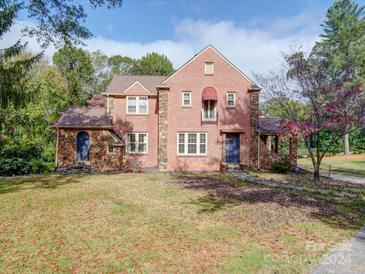 Brick home with stone accents and a landscaped yard at 1116 E Franklin Blvd, Gastonia, NC 28054