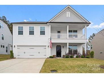 Two story white house with gray accents and balcony at 122 W Heart Pine Ln, Statesville, NC 28677