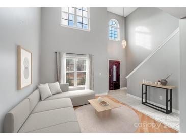 Spacious living room with high ceilings and lots of natural light at 7633 Shiny Meadow Ln, Charlotte, NC 28215