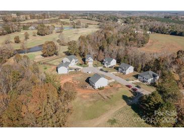 Community overview, showcasing several homes and green space at 103 Golf View Dr, Shelby, NC 28150