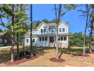 Two-story house with light blue siding, brick accents, and a front porch at 4457 Giles Ave, Sherrills Ford, NC 28673