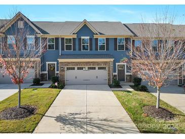 Stunning 3-story townhome with a 2-car garage and well-maintained landscaping at 135 Beacon Dr # D, Mooresville, NC 28117