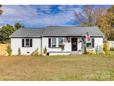 Charming one-story home with white brick and gray roof at 13100 S Church St, Huntersville, NC 28078