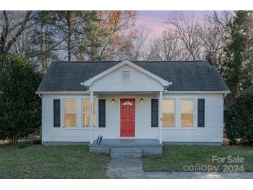 Charming white house with red door, freshly landscaped lawn at 2222 Moose Rd, Kannapolis, NC 28083