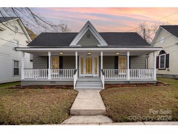 Charming renovated house with front porch and walkway at 409 S Rowan Ave, Spencer, NC 28159