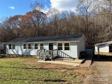 Ranch-style home with a yard and carport at 701 Firecrest Se St, Concord, NC 28025