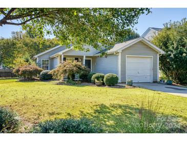 Ranch style home with attached garage, landscaping, and spacious lawn at 1776 Northgate Ln, Rock Hill, SC 29732