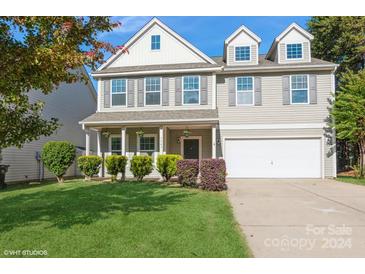 Two-story house with gray siding, a large front yard, and a two-car garage at 5043 Weber Ct, Fort Mill, SC 29715