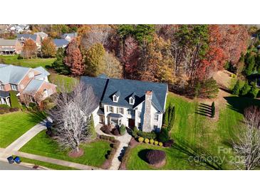 Two-story house with stone accents and a large backyard, seen from above at 708 Ridge Lake Dr, Weddington, NC 28104