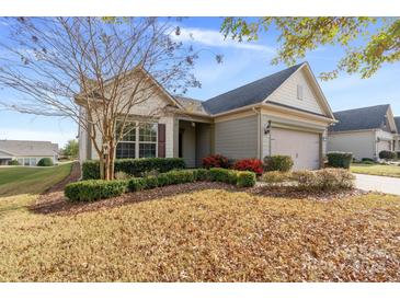 One-story house with neutral siding, attached garage, and manicured landscaping at 356 Harvest Valley Ln, Fort Mill, SC 29715