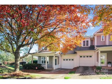 Two-story townhome with attached garage and fall foliage at 19433 Booth Bay Ct, Cornelius, NC 28031