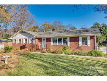 Brick ranch home with a landscaped lawn and driveway at 1249 Christopher Cir, Rock Hill, SC 29730