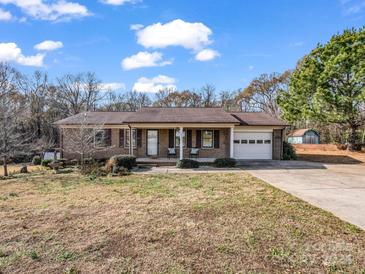 Brick ranch home with attached garage and spacious yard at 910 Tait St, Lincolnton, NC 28092