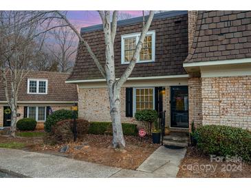 Charming brick home exterior at twilight at 3500 Colony Rd # A, Charlotte, NC 28211