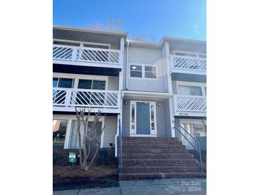 Two-story condo building with brick stairs and balconies at 9530 Shannon Green Dr # K, Charlotte, NC 28213