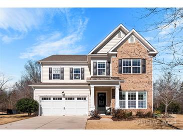 Two-story brick home with a large front yard and two-car garage at 1246 Gold Rush Ct, Fort Mill, SC 29708