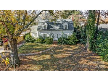 Charming white house with a gabled roof and manicured lawn at 2520 Normandy Rd, Charlotte, NC 28209