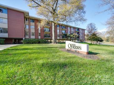 Brick building with landscaping and signage at 1300 Queens at 1300 Queens Rd # 303, Charlotte, NC 28207