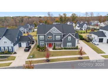 Two-story home aerial view, showcasing a landscaped yard and neighborhood context at 19108 Beecher Commons Dr, Huntersville, NC 28078