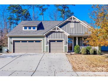 Charming two-story home with a two-car garage and landscaped yard at 415 Sandbar Pt, Lake Wylie, SC 29710