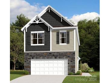 Two-story house with gray and beige siding, stone accents, and a two-car garage at 4027 Lawnview Dr, Charlotte, NC 28269