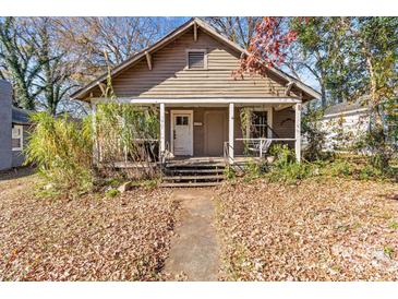 Charming craftsman home with front porch and mature trees at 1617 Parson St, Charlotte, NC 28205