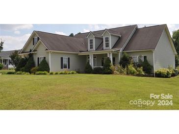 Spacious two-story house with a large front yard and a covered porch at 2505 Mintew Cir, Lincolnton, NC 28092