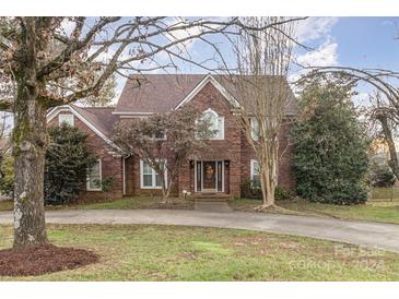 Charming two-story brick home with a welcoming front entrance and landscaped yard at 327 Wednesbury Blvd, Charlotte, NC 28262