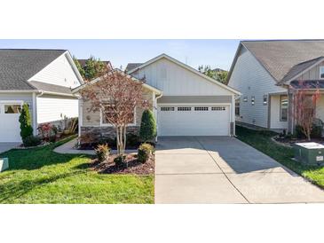 Single-story home with attached garage and landscaped yard at 4779 Looking Glass Trl, Denver, NC 28037