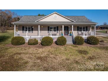 Charming ranch home with covered porch and landscaped yard at 2051 Gary Ln, Hickory, NC 28602