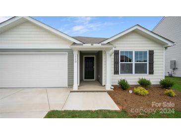 New construction home with a one-car garage, covered entryway, and front yard at 2632 Goose Fair Rd # 62, Maiden, NC 28650