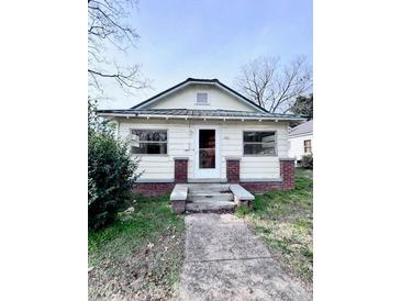 Charming one-story house with brick accents and a well-maintained lawn at 703 Buffalo St, Shelby, NC 28150