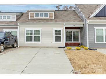 Two-story home with a driveway and front yard at 112 Canina Ln, Indian Trail, NC 28079